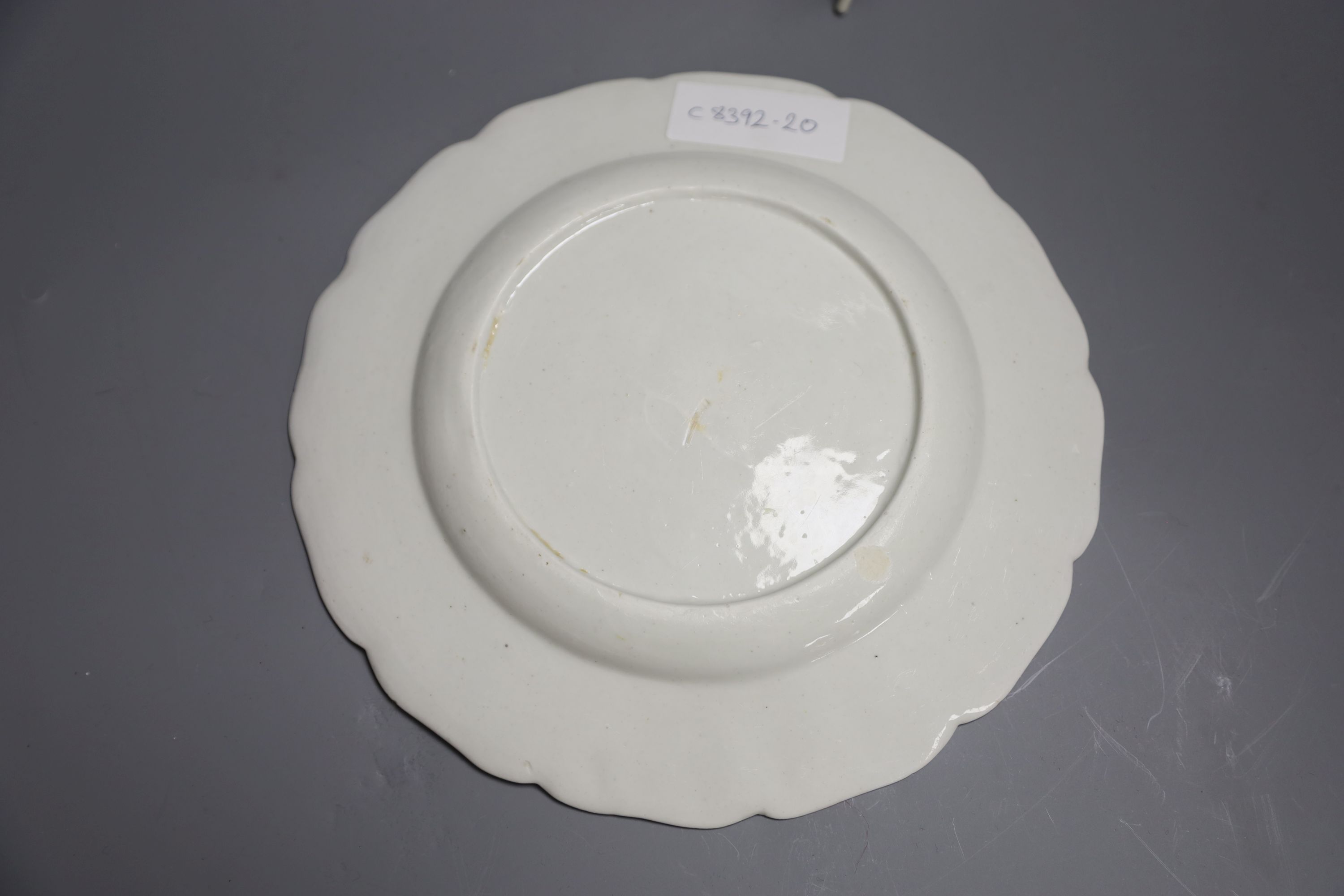 An 18th century Derby shaped plate painted with flower in the manner of the Cotton Stem painter, diameter 22cm